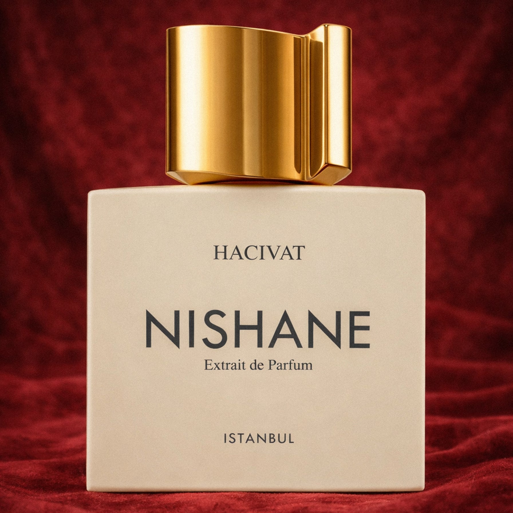 Nishane Hacivat perfume bottle. on a red background